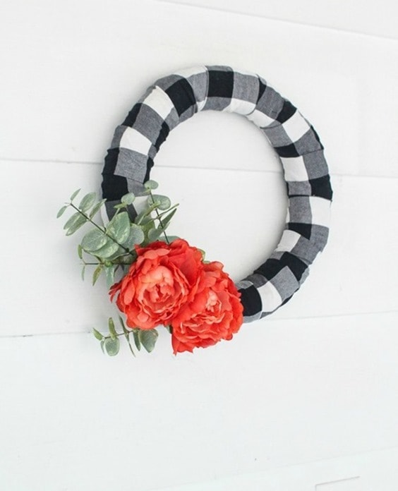 Make an easy buffalo plaid modern farmhouse wreath. It's the perfect way to upcycle a plaid shirt or simply buy a bit of buffalo plaid fabric.