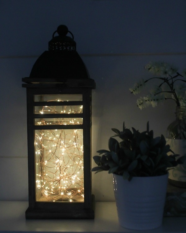 diy fairy light lantern shown on counter at night so the lights show.