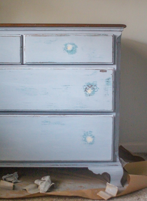 sanding the dresser before painting