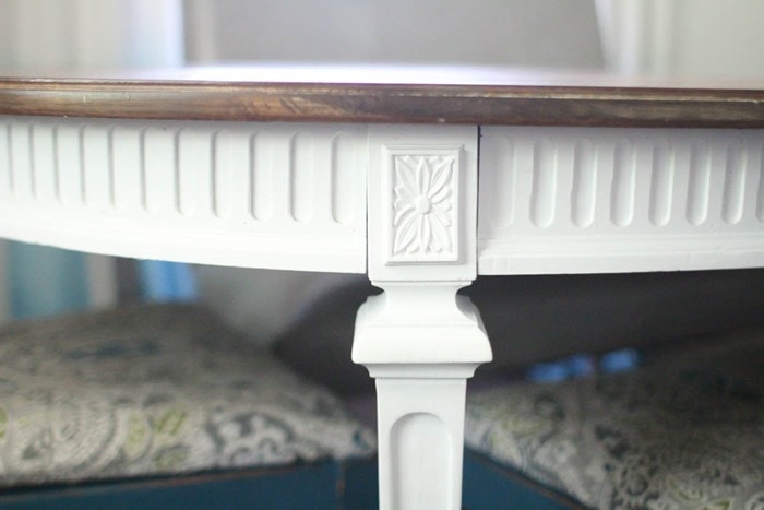 close up of details of white table legs and apron