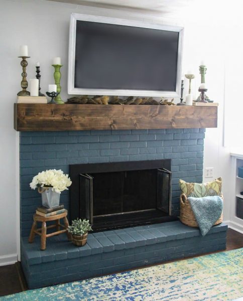 Simple fall mantel decor. This blue brick fireplace and diy rustic mantel are the perfect backdrop for easy thrifted fall decor. 