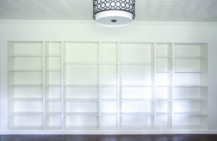 Wall of DIY IKEA billy built-in bookcases