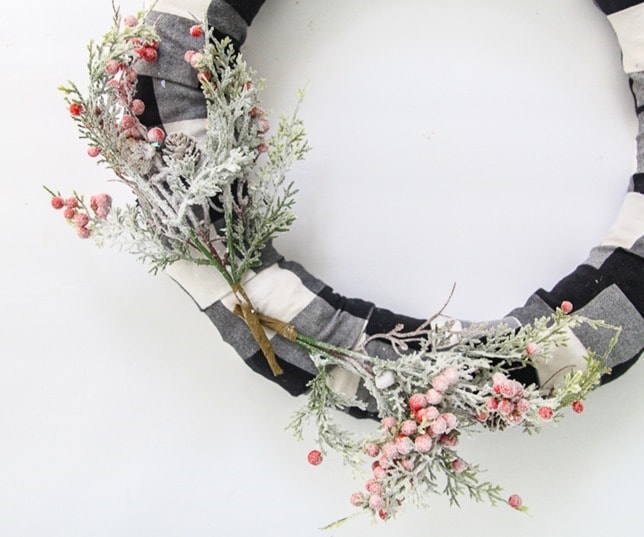 attach the branches to make DIY buffalo plaid Christmas wreath.