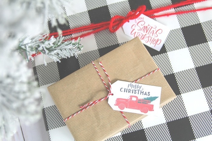 present wrapped with plaid wrapping paper and from Santa's workshop tag and present wrapped with brown wrapping paper and printable red truck Christmas tag.