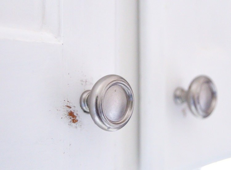 painted cabinets with scratched paint