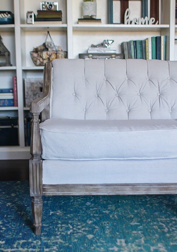 close up of reupholstered couch with tufted back