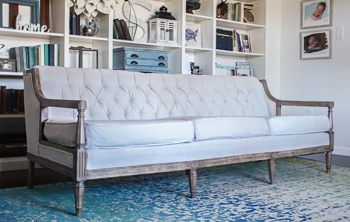 couch reupholstered with drop cloth with a painted weathered wood finish