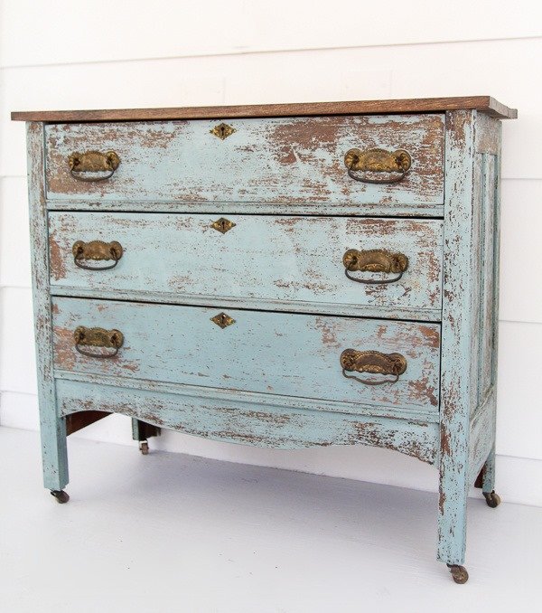 Farmhouse dresser makeover with chippy blue paint.