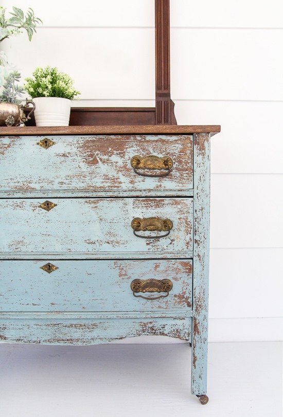 Blue chippy farmhouse dresser painted with old-fashioned milk paint.