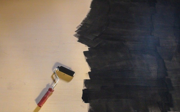 painting plywood with chalkboard paint using a small foam roller