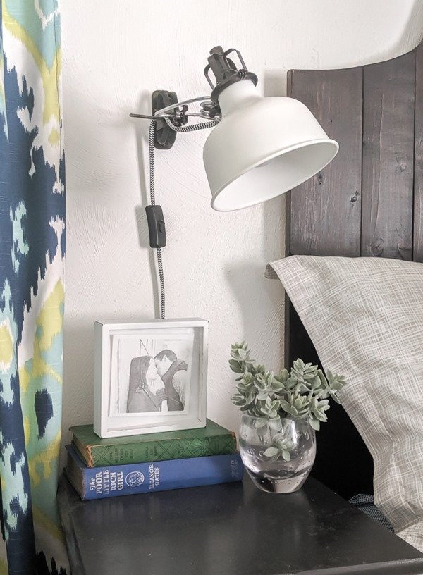 IKEA ranarp sconce beside bed