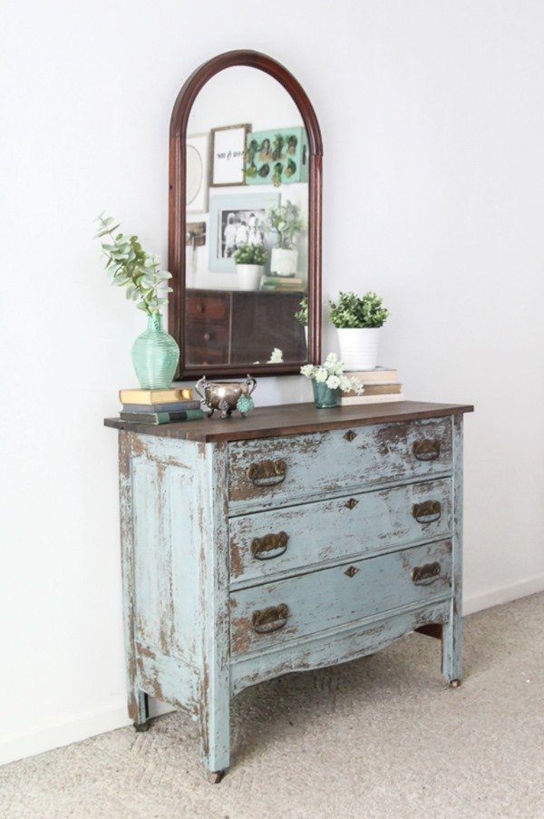 Chippy blue farmhouse dresser and vintage mirror; this pair can warm up any space.