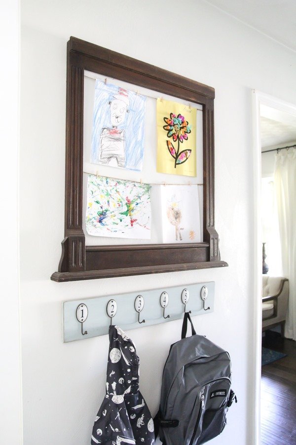 Kids art display frame and backpack station.