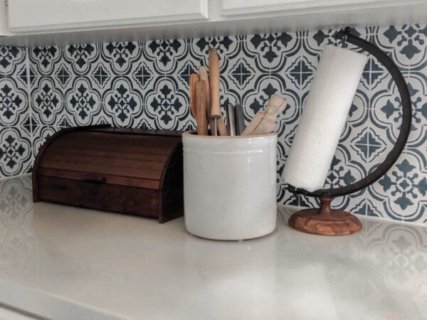 Add warmth and character to a white modern farmhouse kitchen with warm wood tones and vintage finds.