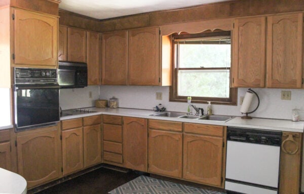 oak cabinets in kitchen before makeover