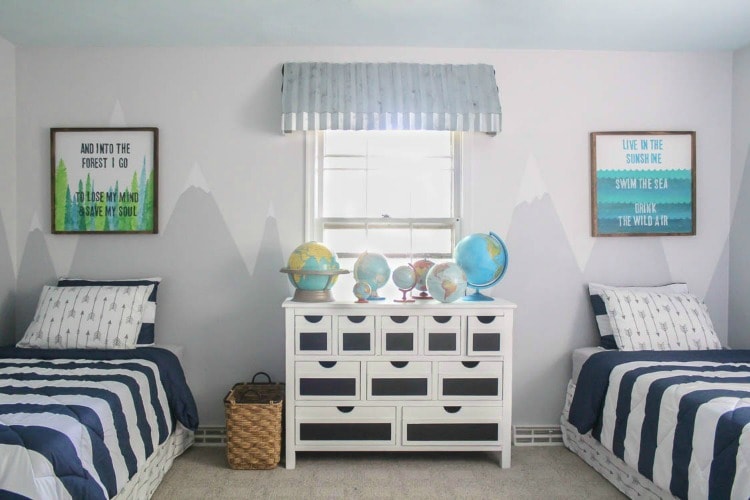 shared boys room with mountain mural and vintage globes