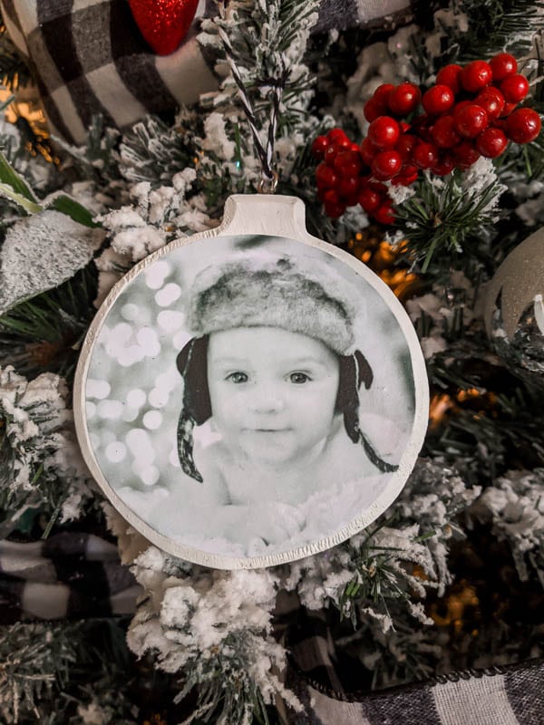 Simple DIY photo ornament with a black and white photo of baby's first Christmas.