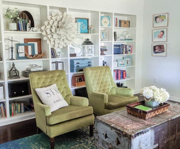 living room with wall of built in bookshelves