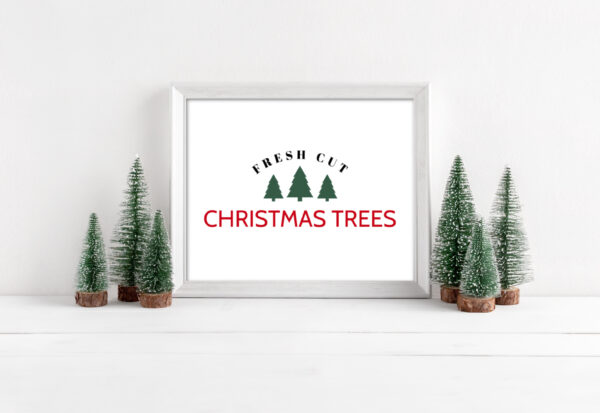 Fresh Cut Christmas Trees Free Printable in a frame next to mini Christmas trees.