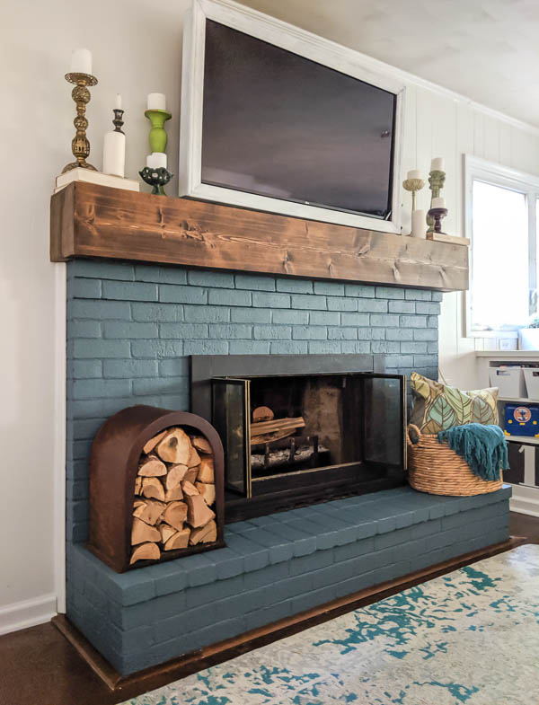 fireplace painted blue with tv