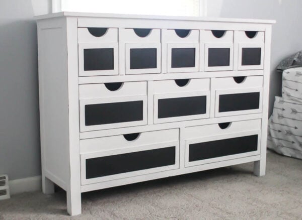 farmhouse style dresser painted white with chalkboard labels.