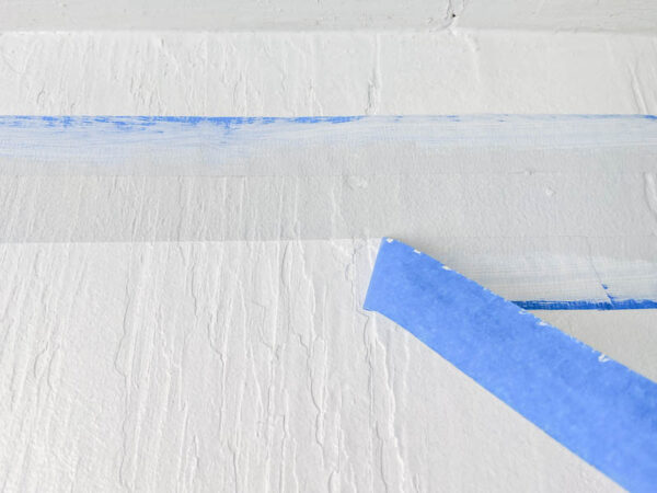 removing painter's tape for a perfect paint line