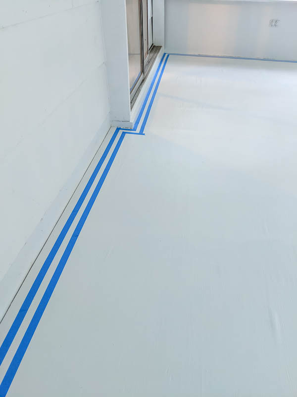 using painter's tape to create a border for painted floor