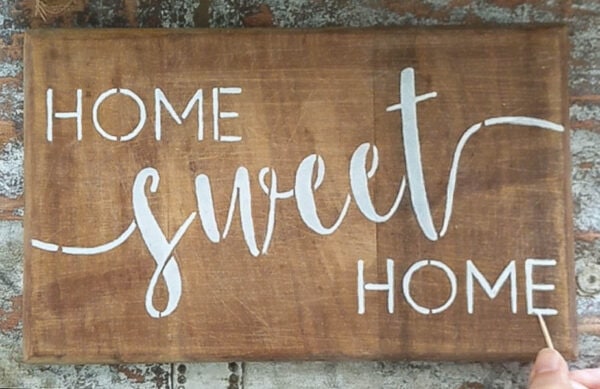 wood sign with home sweet home stenciled