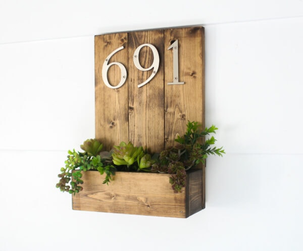 diy house number made from wood planks with a succulent planter below the numbers