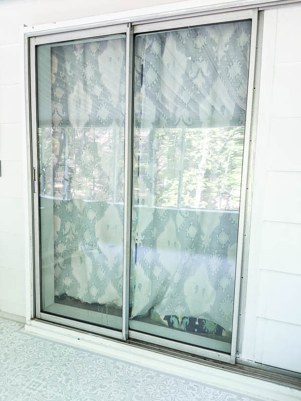 sliding glass doors with metal frame and track