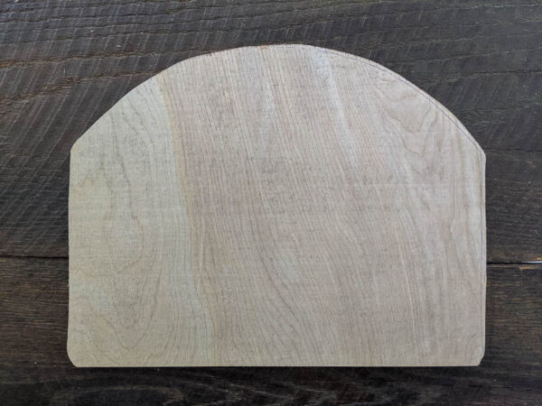 plywood cut into an arch shape to fit frame