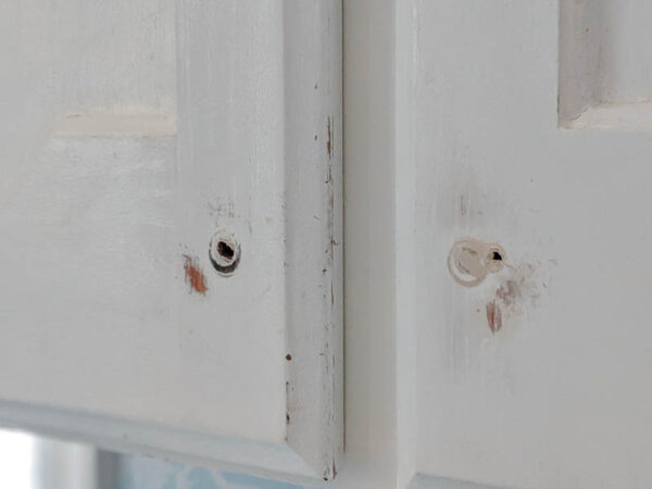 chipped cabinets after lightly sanding the chipped areas