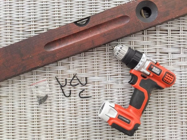 materials for making wall hooks from antique level - wooden level, small hooks, screws, drill