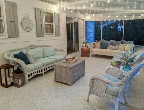 screened-in porch with white string lights