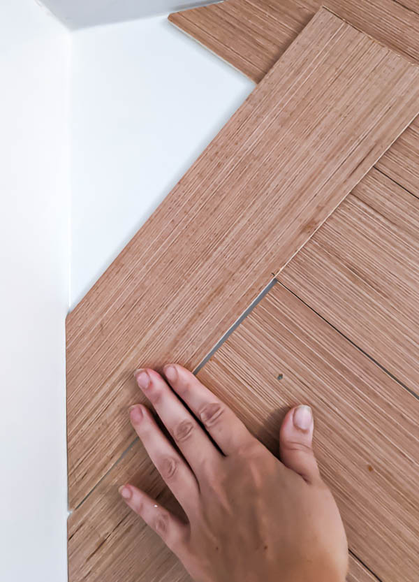 How to DIY a Herringbone Wood Wall on a Budget Lovely Etc.