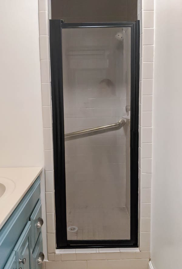 Shower door frame painted black