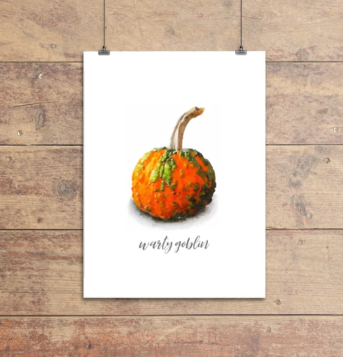 watercolor print of a small orange warty goblin pumpkin covered in green warts.
