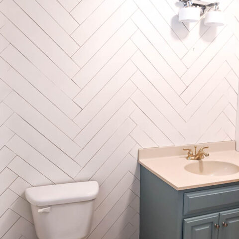 DIY herringbone wood wall in bathroom