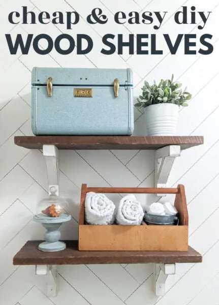 reclaimed wood bathroom shelves with diy white shelf brackets against a white herringbone wall with text: cheap and easy diy wood shelves.