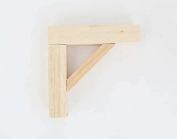 simple diy wood shelf bracket before adding paint or stain