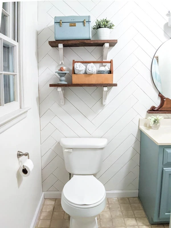 diy bathroom shelves hanging over toilet.