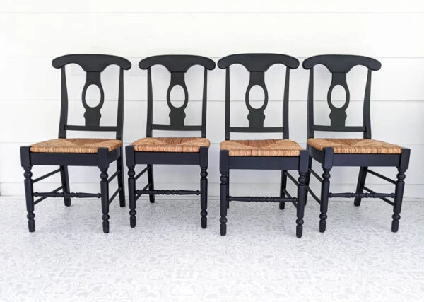 Wooden chairs with woven seats painted black