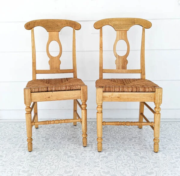 two light wood chairs with woven seats before paint
