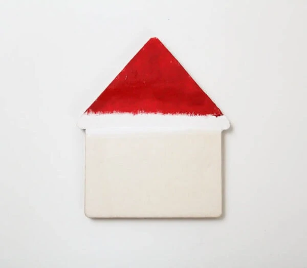 house shape with roof painted red and white like Santa's hat