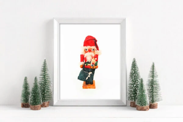 Framed Christmas printable art with vintage Santa nutcracker.