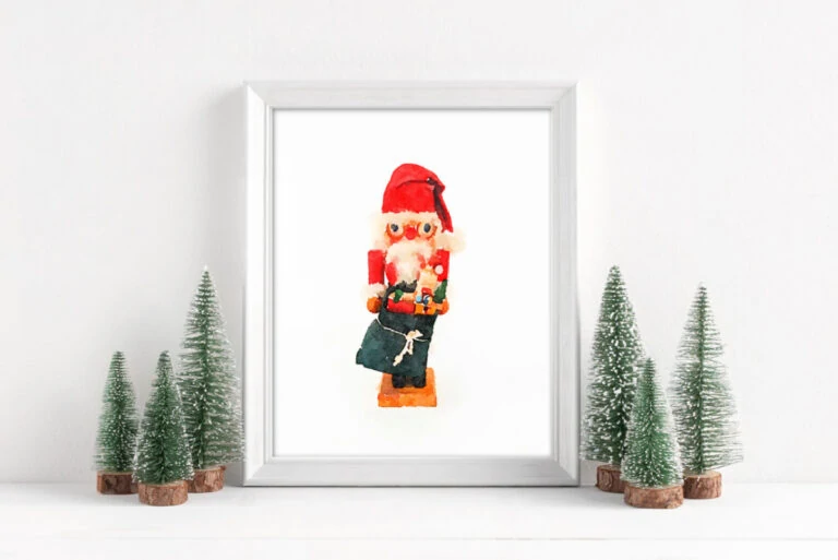 Framed Christmas printable art with vintage Santa nutcracker.