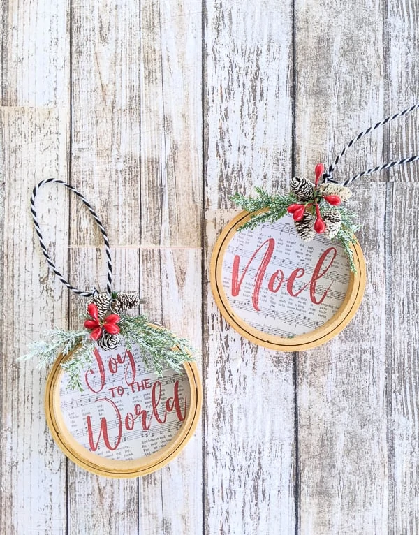 DIY embroidery hoop ornaments made using the songs Joy to the World and Noel.