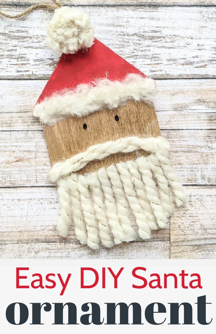 close up of wooden Santa ornament with yarn beard