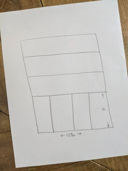 simple diagram of silverware drawer layout drawn on paper.