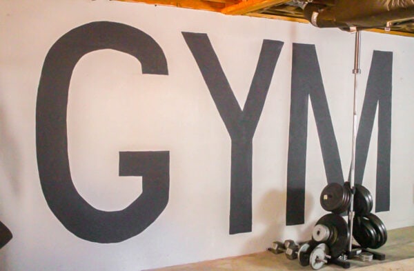 huge letters spelling gym painted on wall.